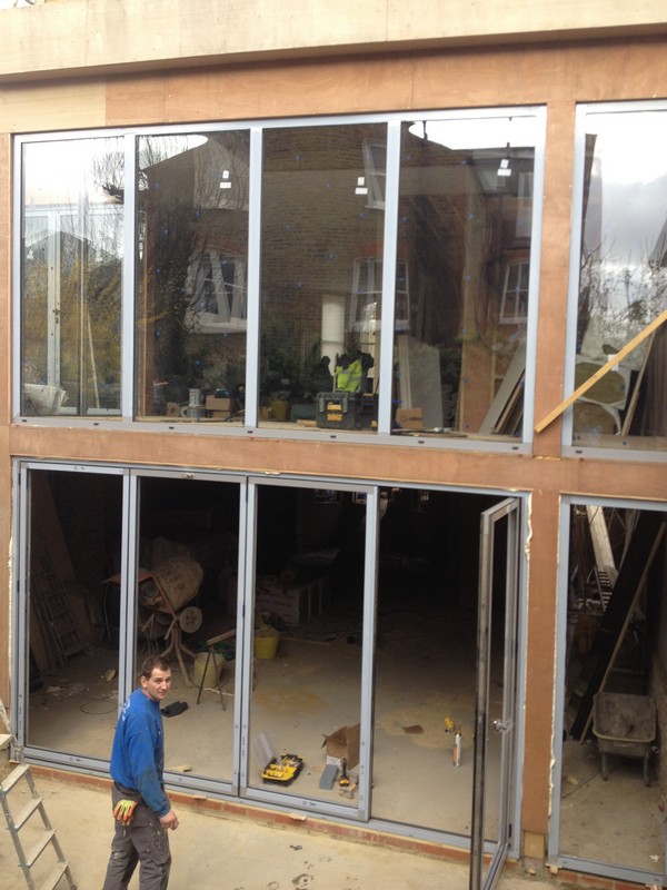 Aluminium bi-fold doors with two-storey glazing in Brixton