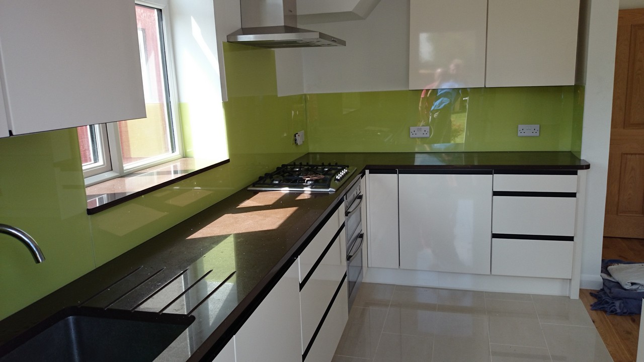 Lime green glass kitchen splashback installed by Brixton glaziers