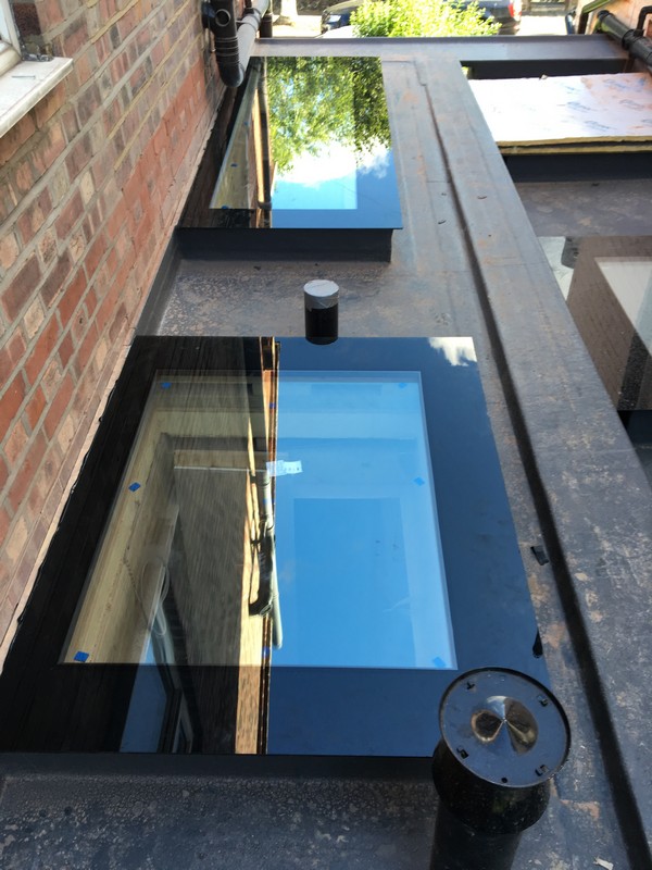 Multiple flat roof skylights on extension in Brixton