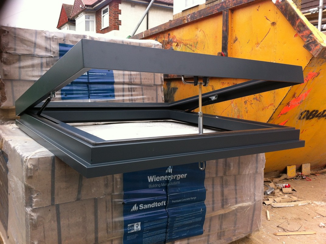 Opening flat roof skylight in anthracite grey installed in Brixton